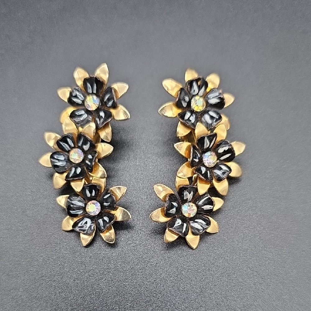 Coro black and white enamel flower earrings in a gold tone clip-on earrings